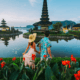Tourists exploring a serene temple in Bali, highlighting travel tips including how to extend visa in Bali.